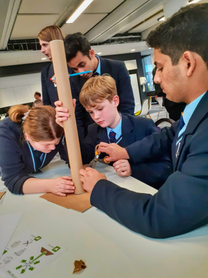 Climate conference, students building a model wind turbine